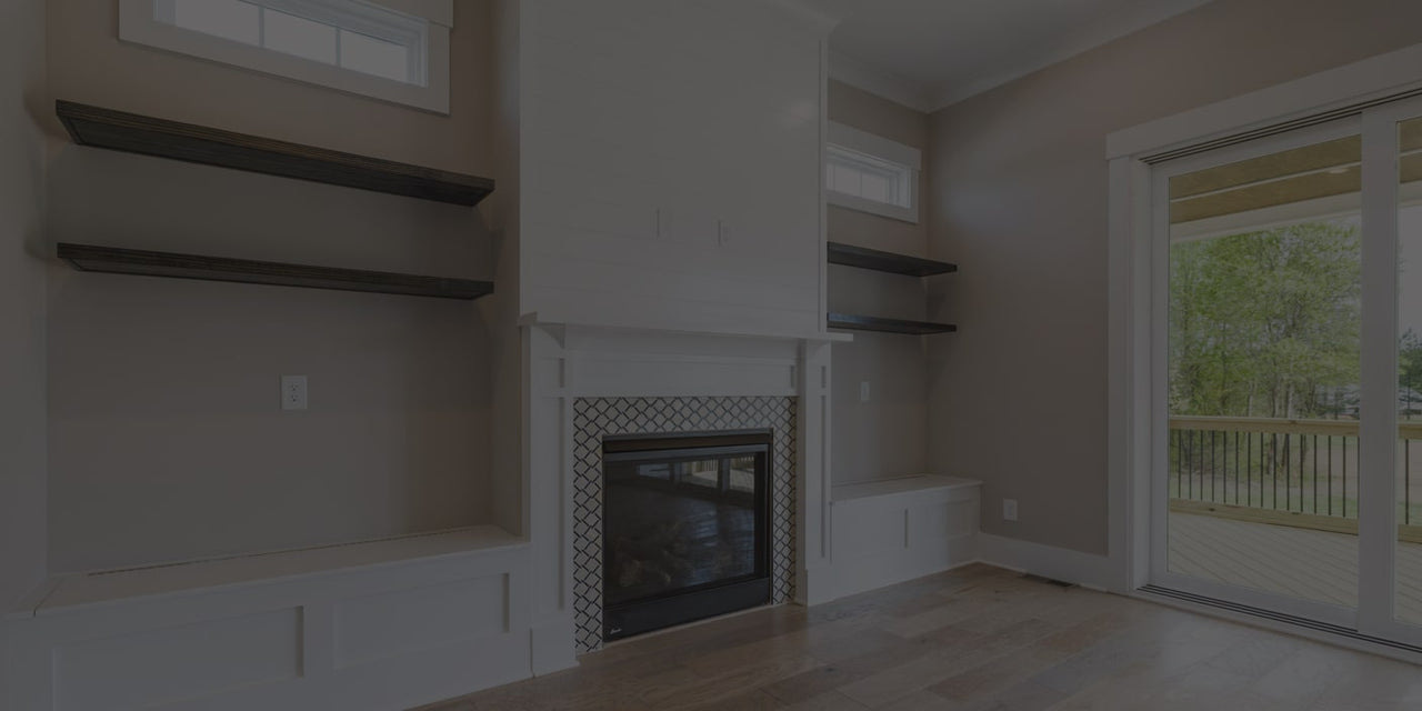Image of custom carpentry built-ins around fireplace with mantel